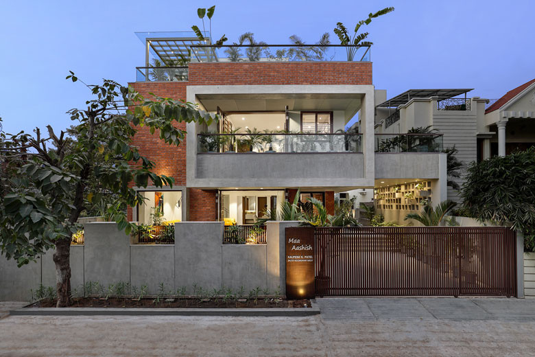An open central courtyard binds all three floors of this family home ...