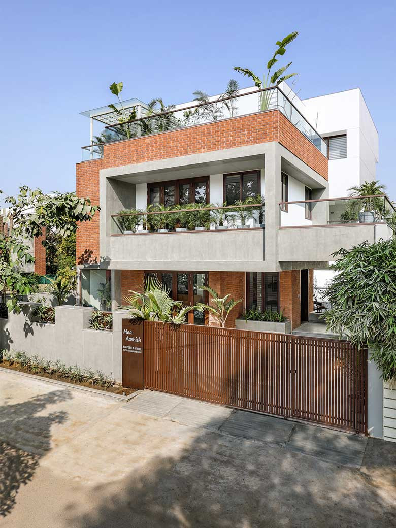 An open central courtyard binds all three floors of this family home ...